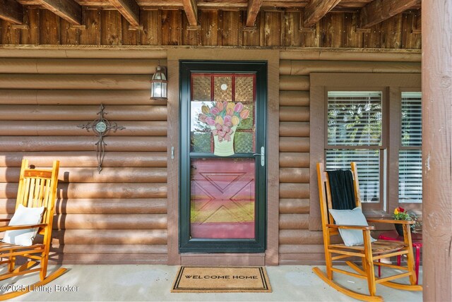 3804 Grassy Creek Dr, Lexington, KY 40503 - view of exterior entry featuring board and batten siding and log veneer siding