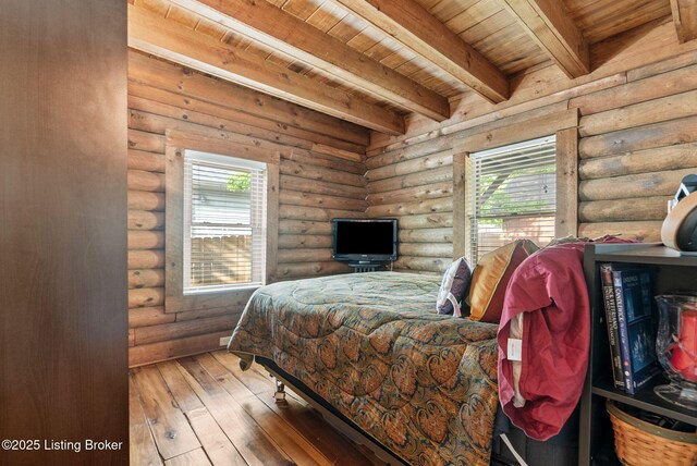 3804 Grassy Creek Dr, Lexington, KY 40503 - bedroom featuring wood ceiling with exposed beams, hardwood / wood-style flooring, and log walls
