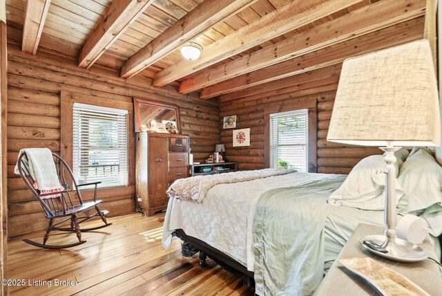 3804 Grassy Creek Dr, Lexington, KY 40503 - bedroom featuring wooden ceiling with exposed beams, light wood-style floors, and log walls