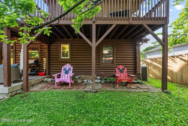 3804 Grassy Creek Dr, Lexington, KY 40503 - back of property with log exterior, a balcony, central AC unit, and a patio