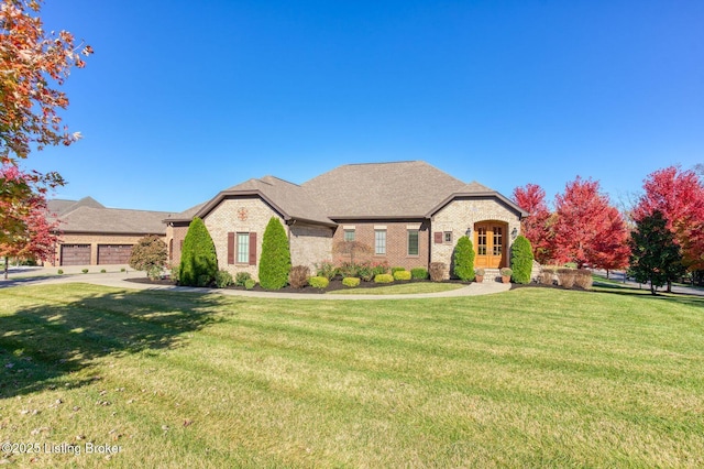 5201 Spring Mist Ct, Prospect, KY 40059 - french country style house featuring brick siding, a front lawn, french doors, and a shingled roof