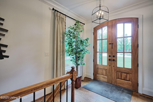 5201 Spring Mist Ct, Prospect, KY 40059 - entryway with french doors, crown molding, a chandelier, light wood-style floors, and baseboards