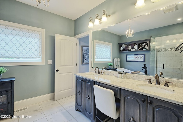 5201 Spring Mist Ct, Prospect, KY 40059 - bathroom featuring marble look tile flooring, a shower stall, double vanity, baseboards, and a chandelier