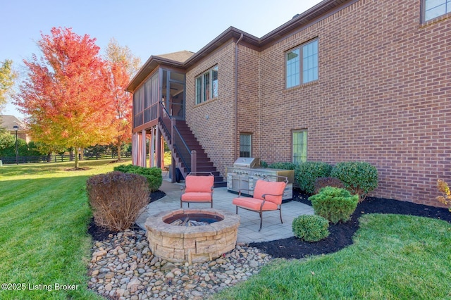 5201 Spring Mist Ct, Prospect, KY 40059 - view of patio with an outdoor fire pit, stairway, and a sunroom