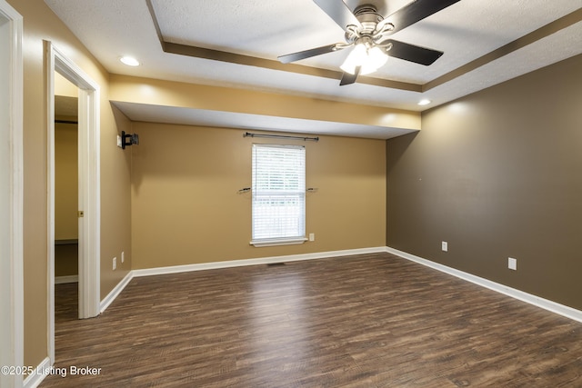 6821 James Madison Way, Louisville, KY 40272 - spare room featuring wood finished floors, ceiling fan, baseboards, a raised ceiling, and recessed lighting