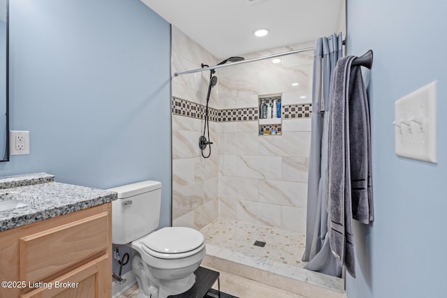 3106 Ramser Ave, Louisville, KY 40216 - bathroom with vanity, a tile shower, and tile patterned floors