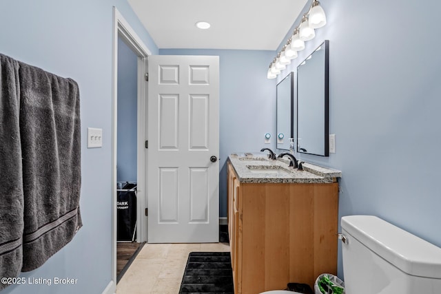 3106 Ramser Ave, Louisville, KY 40216 - bathroom with double vanity and tile patterned floors