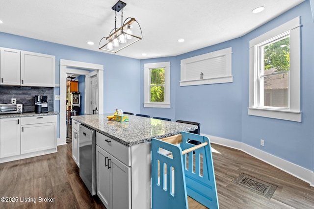 3106 Ramser Ave, Louisville, KY 40216 - kitchen with recessed lighting, plenty of natural light, stainless steel dishwasher, and dark wood-style flooring