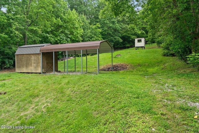 10711 Jefferson Hill Rd, Fairdale, KY 40118 - view of grassy yard featuring a carport and a forest view