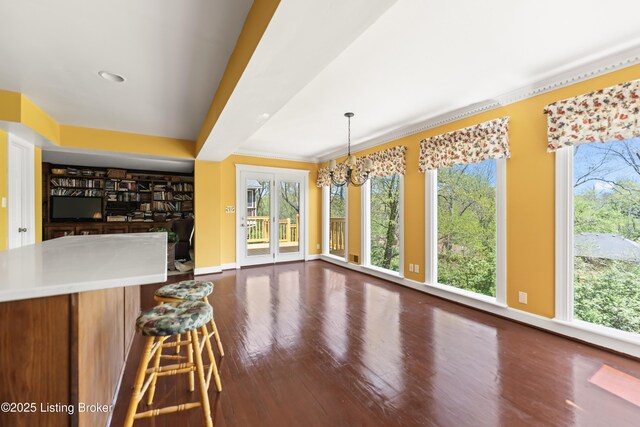 2309 Phoenix Hill Dr, Louisville, KY 40207 - unfurnished dining area with dark wood-type flooring, a chandelier, and baseboards