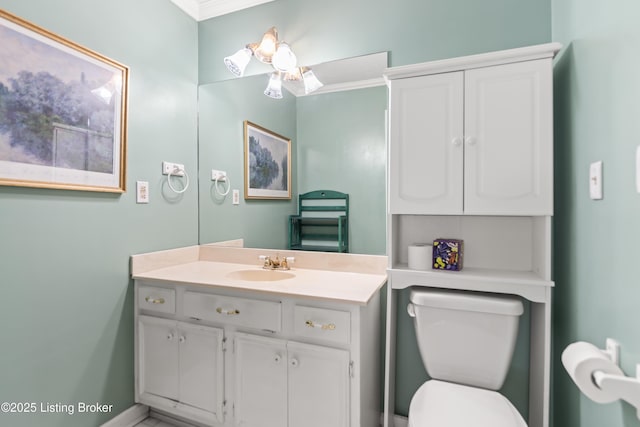 2309 Phoenix Hill Dr, Louisville, KY 40207 - bathroom featuring vanity, toilet, crown molding, and baseboards