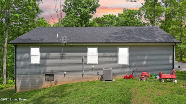 987 Wheelers Mill Rd, Munfordville, KY 42765 - back of property featuring a yard, central AC unit, and roof with shingles