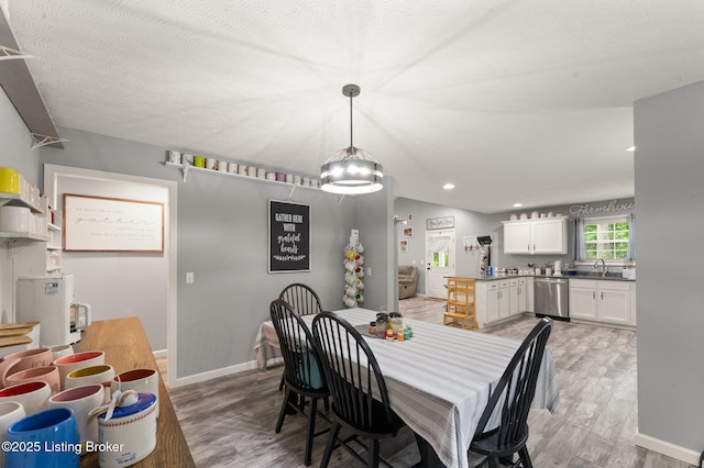 987 Wheelers Mill Rd, Munfordville, KY 42765 - dining area featuring light wood finished floors, baseboards, a chandelier, and recessed lighting