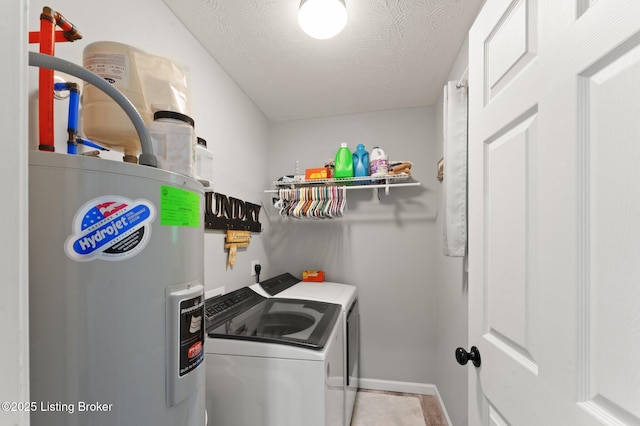 987 Wheelers Mill Rd, Munfordville, KY 42765 - washroom with water heater, washing machine and clothes dryer, a textured ceiling, and baseboards
