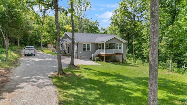 987 Wheelers Mill Rd, Munfordville, KY 42765 - view of front of house featuring a porch, crawl space, a front lawn, driveway, and roof with shingles