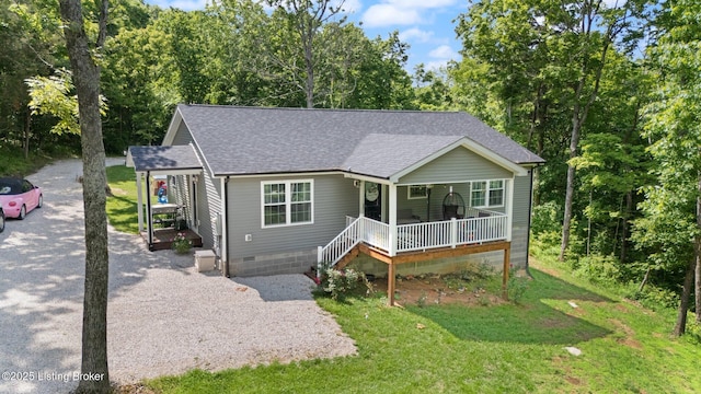 987 Wheelers Mill Rd, Munfordville, KY 42765 - view of front facade with covered porch, a shingled roof, crawl space, and a front lawn