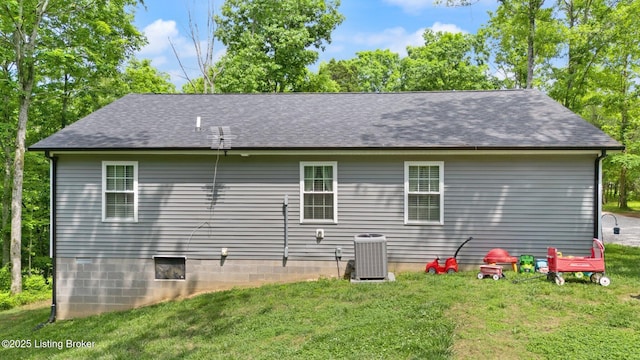 987 Wheelers Mill Rd, Munfordville, KY 42765 - rear view of house with a yard, central AC unit, and a shingled roof