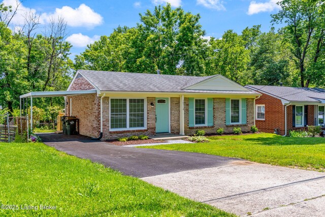 10518 Fairview Ave, Louisville, KY 40299 - ranch-style home featuring asphalt driveway, brick siding, a carport, and a front yard