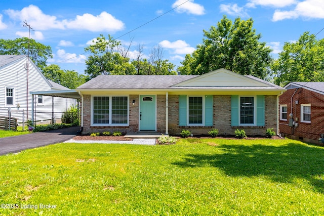 10518 Fairview Ave, Louisville, KY 40299 - view of front of property featuring brick siding, asphalt driveway, and a carport