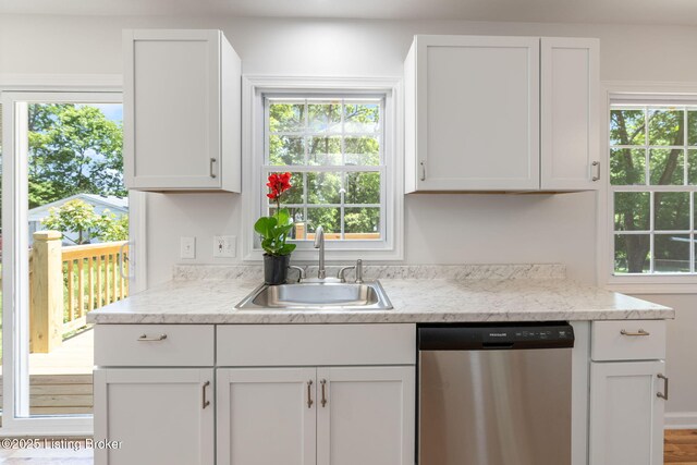 10518 Fairview Ave, Louisville, KY 40299 - kitchen featuring dishwasher, a sink, healthy amount of natural light, and white cabinets