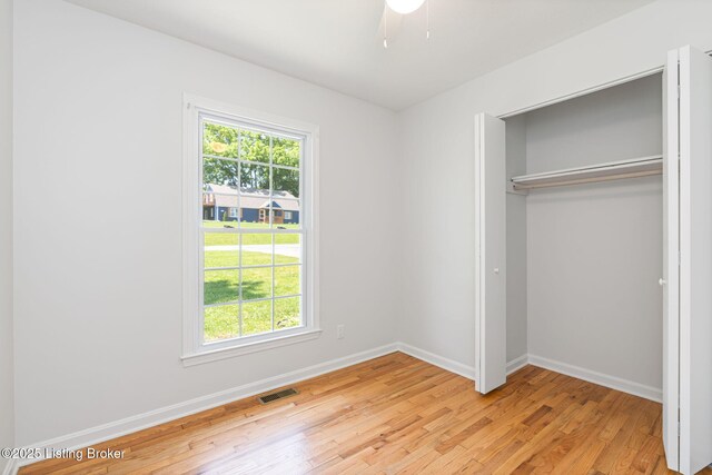 10518 Fairview Ave, Louisville, KY 40299 - unfurnished bedroom featuring light wood-type flooring, a closet, baseboards, and ceiling fan
