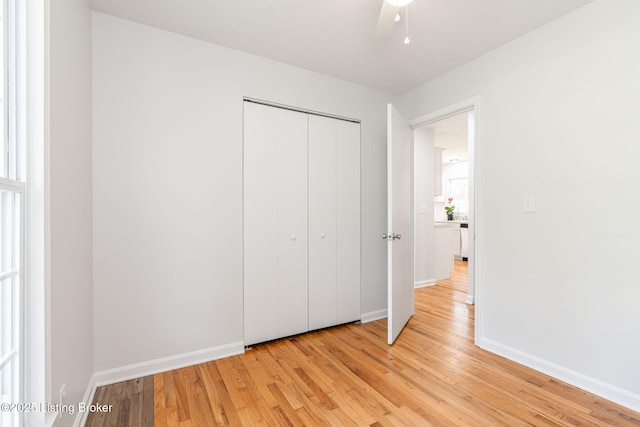 10518 Fairview Ave, Louisville, KY 40299 - unfurnished bedroom with light wood-style floors, baseboards, and a closet