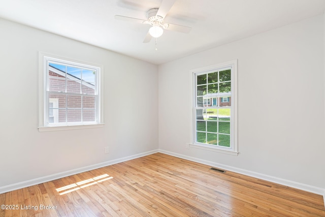10518 Fairview Ave, Louisville, KY 40299 - unfurnished room with light wood-style floors, baseboards, healthy amount of natural light, and ceiling fan