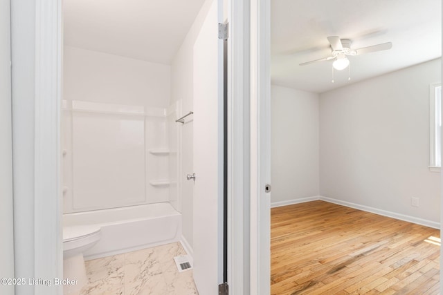 10518 Fairview Ave, Louisville, KY 40299 - bathroom with toilet, a ceiling fan, baseboards, and shower / bath combination