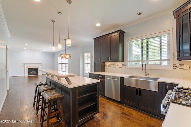 3613 Wynbrooke Cir, Louisville, KY 40241 - kitchen featuring appliances with stainless steel finishes, a sink, ornamental molding, backsplash, and healthy amount of natural light