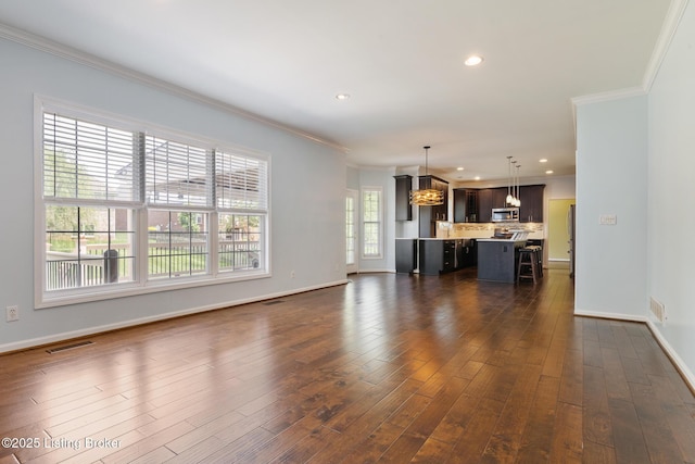 3613 Wynbrooke Cir, Louisville, KY 40241 - unfurnished living room featuring ornamental molding, dark wood-style flooring, a chandelier, recessed lighting, and baseboards