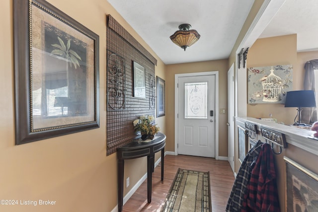 140 Ample Way, Shepherdsville, KY 40229 - foyer with wood finished floors, baseboards, and a dry bar