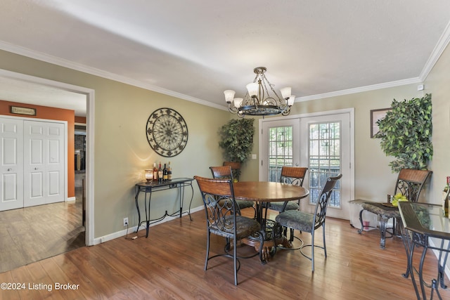 140 Ample Way, Shepherdsville, KY 40229 - dining area with a chandelier, wood finished floors, crown molding, and baseboards