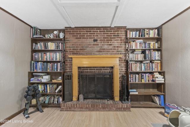140 Ample Way, Shepherdsville, KY 40229 - living room with a brick fireplace, wood finished floors, and wood walls
