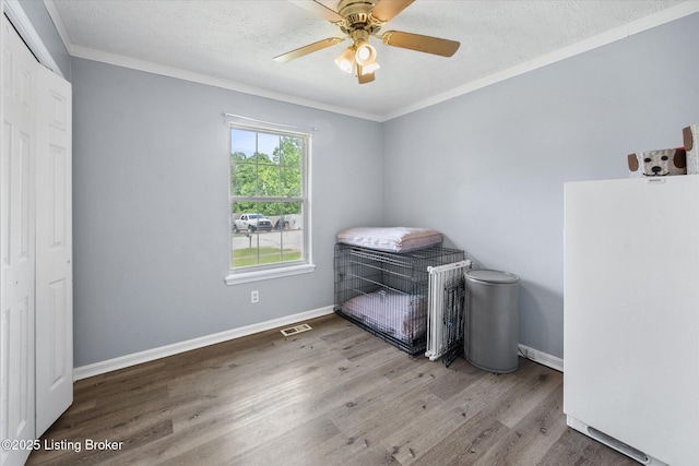 1300 Keane Ave, La Grange, KY 40031 - bedroom featuring freestanding refrigerator, wood finished floors, crown molding, baseboards, and a ceiling fan