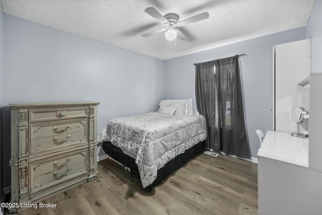 1300 Keane Ave, La Grange, KY 40031 - bedroom featuring wood finished floors, a textured ceiling, ceiling fan, and baseboards
