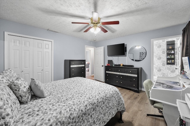 1300 Keane Ave, La Grange, KY 40031 - bedroom with light wood finished floors, a closet, a ceiling fan, a textured ceiling, and baseboards