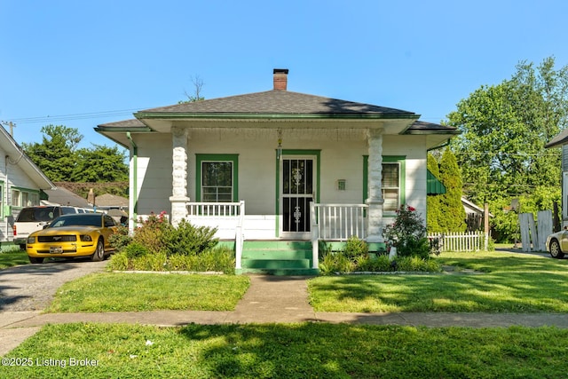 2028 S 16th St, Louisville, KY 40210 - bungalow-style house featuring covered porch, a chimney, and roof with shingles