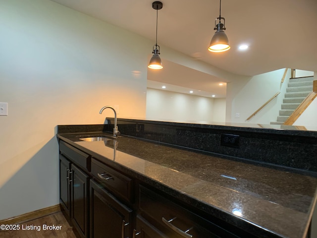 5101 Elm Tree Pl, Louisville, KY 40299 - kitchen with a sink, pendant lighting, dark stone countertops, and baseboards