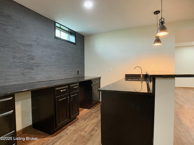 5101 Elm Tree Pl, Louisville, KY 40299 - kitchen with a sink, dark countertops, light wood finished floors, decorative light fixtures, and dark cabinetry