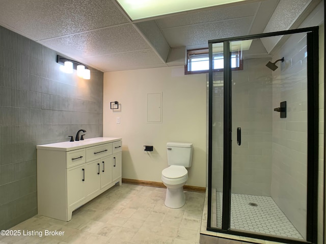 5101 Elm Tree Pl, Louisville, KY 40299 - bathroom with vanity, a stall shower, toilet, and tile walls