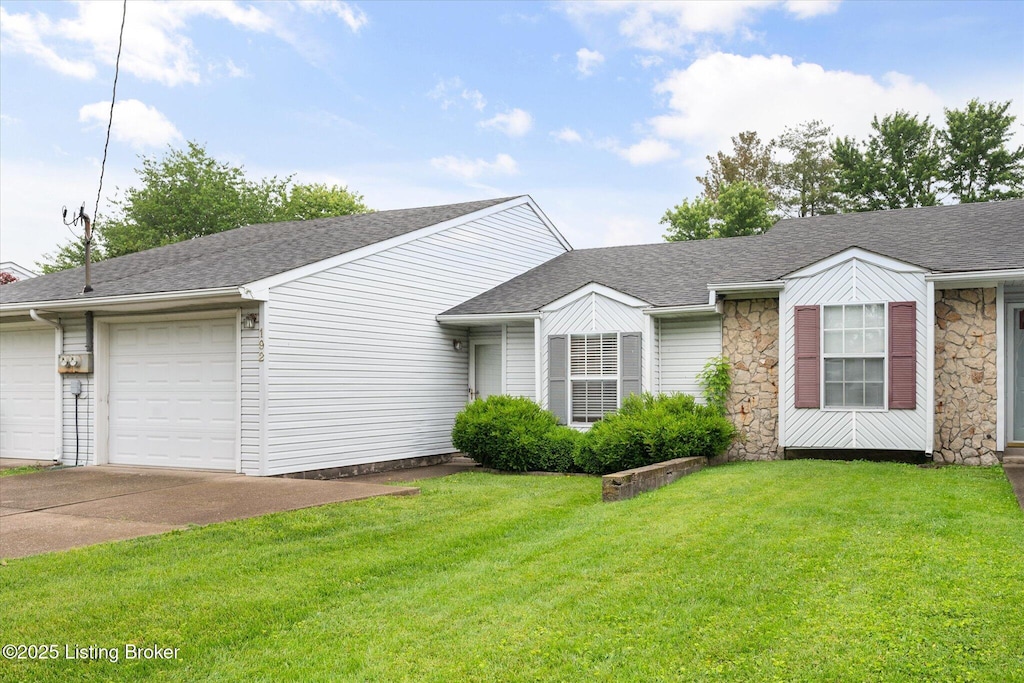 192 Jeffie Ln, Shepherdsville, KY 40229 - view of front of home with concrete driveway, an attached garage, and a shingled roof