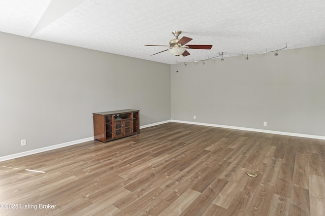 12308 Dominion Way, Louisville, KY 40299 - unfurnished room with ceiling fan, wood finished floors, baseboards, and a textured ceiling