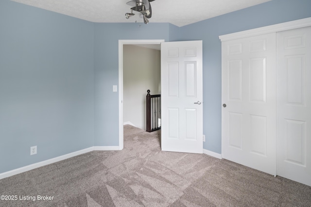 12308 Dominion Way, Louisville, KY 40299 - unfurnished bedroom featuring carpet, baseboards, and a closet