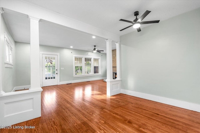 1907 Culbertson Ave, New Albany, IN 47150 - unfurnished living room with ornate columns, a ceiling fan, wood finished floors, baseboards, and recessed lighting
