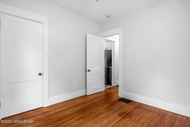 1907 Culbertson Ave, New Albany, IN 47150 - unfurnished bedroom featuring wood finished floors and baseboards