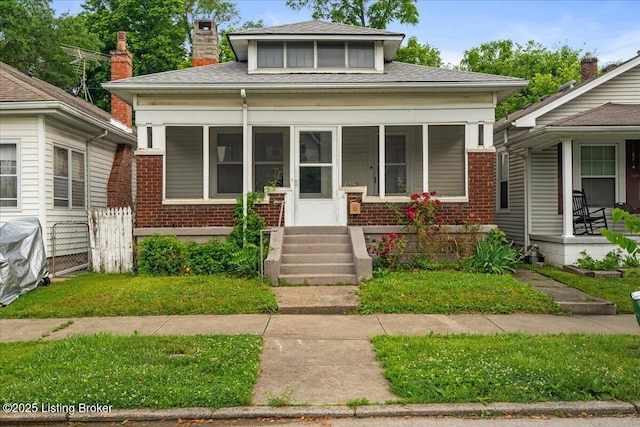 1907 Culbertson Ave, New Albany, IN 47150 - bungalow-style house featuring brick siding, covered porch, a chimney, and a shingled roof