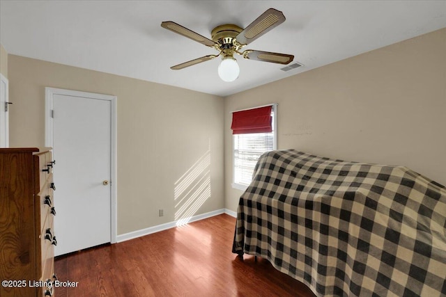8400 Wisertown Rd, Louisville, KY 40214 - bedroom with wood finished floors, baseboards, and ceiling fan