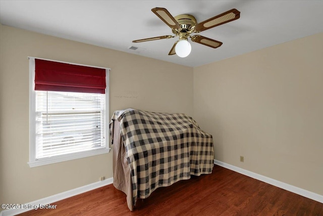 8400 Wisertown Rd, Louisville, KY 40214 - bedroom with wood finished floors, baseboards, and ceiling fan