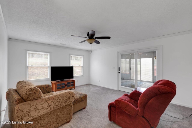 8400 Wisertown Rd, Louisville, KY 40214 - living area with carpet, a ceiling fan, crown molding, a textured ceiling, and baseboards