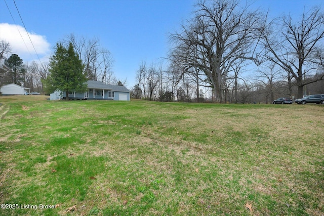 8400 Wisertown Rd, Louisville, KY 40214 - view of green lawn with an attached garage